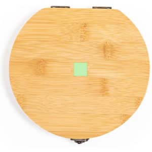 A round bamboo tool set with a green square detail on the top, featuring metal closures.