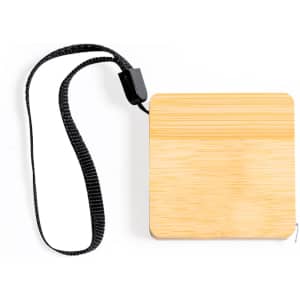 A wooden square tape measure with a black strap. The tape measure features a natural bamboo appearance.