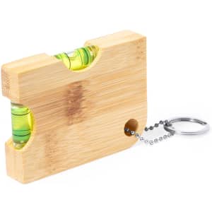 A drink bottle opener keyring made of bamboo with a two-bubble spirit level and metal chain attachment.