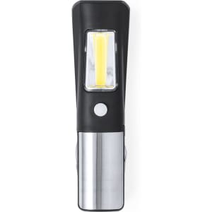 A black and silver Layla Multitool featuring a flashlight with a yellow light strip and a clip for keyring attachment.