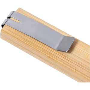 A silver Lirson Cutter resting on a wooden surface, showcasing its sleek design.