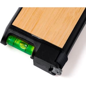 A tape measure with a black casing and a wooden finish, featuring a built-in green bubble level.