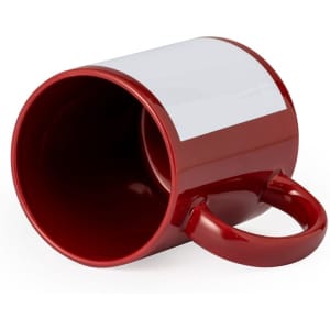 A red sublimation coffee mug with a plain white surface for custom designs, featuring a round handle.