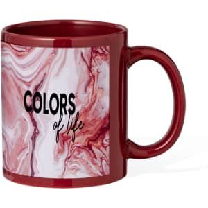 A coffee mug in burgundy with a pink and white marble design, featuring the text "COLORS of life" and a logo.