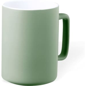 A green coffee mug with a matte exterior and a white interior, featuring a sturdy handle.