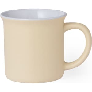 A coffee mug in pale yellow with a smooth finish and a contrasting white interior, featuring a handle.