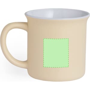 A beige coffee mug with a white interior and a square area for custom branding.