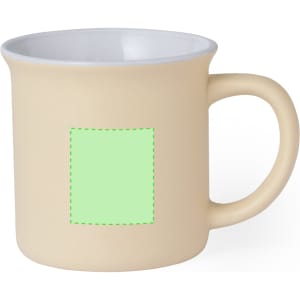 A coffee mug in a beige tone with a white interior and a blank area for custom designs.