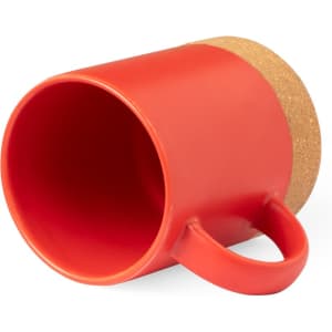A red coffee mug with a cork base and a handle, featuring a simple design.