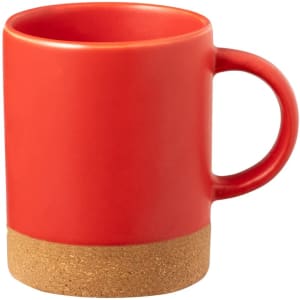 A red coffee mug with a cork base and a smooth handle, featuring a simple, modern design.
