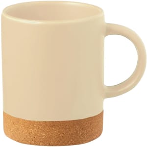 A coffee mug in a cream colour with a cork bottom and a stylish handle. It features a logo.