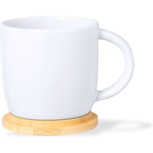 A white coffee mug rests on a bamboo base, featuring a simple design and smooth finish.