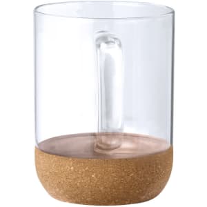 A clear glass mug with a cork base and a handle, featuring a minimalist design.