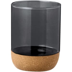 A drink cup featuring a clear dark grey body and a cork base; includes a logo on the surface.