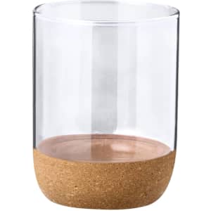 A clear drink cup featuring a cork base, ideal for various beverages. It has a minimalist and modern design.
