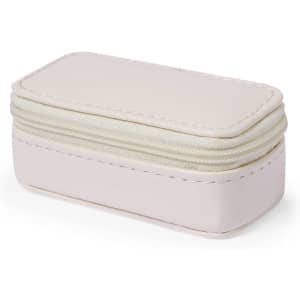 A small, rectangular toiletry bag in a soft pink colour with a zip closure and white stitching.