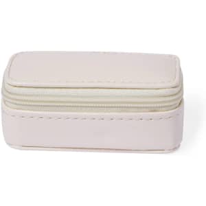 A small, rectangular, pale pink jewellery wrap with a zip closure, featuring a plain design and a subtle logo.