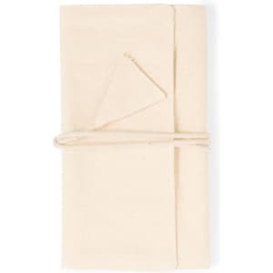 A cream-coloured jewellery wrap made from fabric, neatly folded and tied with twine, featuring a small triangular pocket.