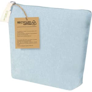A light blue toiletry bag made from recycled cotton, featuring a tag with information about its material.