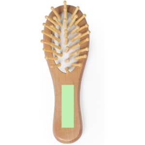 A wooden hairbrush with a rounded body and yellow bristles, featuring a blank space on the handle.