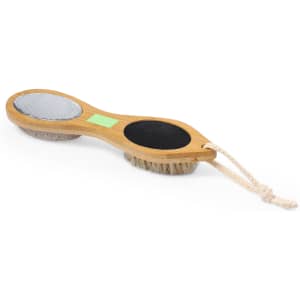 An exfoliating massage brush with a wooden handle, featuring a soft bristle side and a textured surface, with a rope loop.