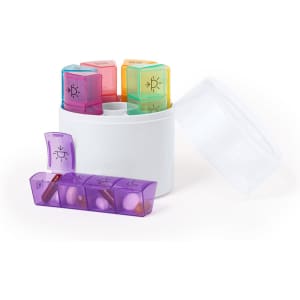 A pillbox with a white container and colourful compartments in pink, orange, green, and purple for organising medications.