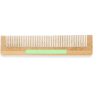A wooden comb with a light green handle, featuring evenly spaced teeth and a smooth finish.
