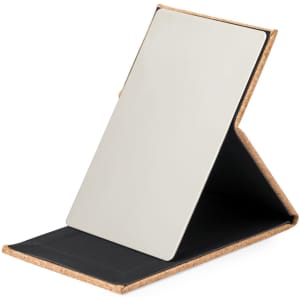 A pocket mirror with a reflective surface and a foldable cork casing, featuring a black interior.