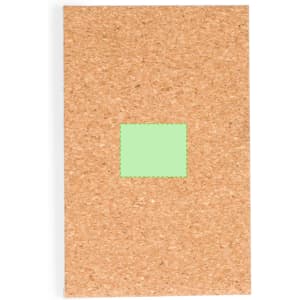 A cork-covered pocket mirror with a green square accent. The mirror is rectangular and features a branding logo.