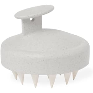 A light grey hair scalp massager with soft spikes, designed for personal care. It features a handle and is smooth to touch.