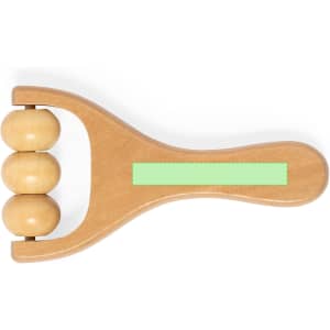 A wooden massager featuring three rounded rollers on a curved handle, with a smooth finish and a light green accent.