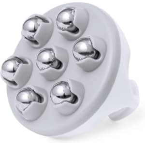 A white massager attachment with six metallic balls for use with a massage device.