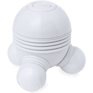 A white massage device with rounded shapes and three small feet, designed for personal health and wellness.