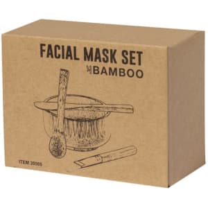 A kraft box containing a facial mask set, featuring bamboo tools and an illustrated design.