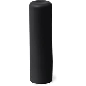 A cylindrical black container with a smooth surface, designed to hold lip balm. It has a minimalist style.
