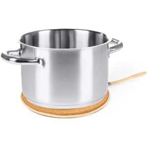A stainless steel pot sits on a cork base, featuring two handles for easy lifting.