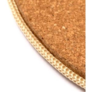 A cork product with a woven beige edge, suitable for home use. It features a round shape and natural texture.