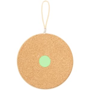A circular cork holder in a natural beige colour with a mint green centre, featuring a zip and a loop handle.