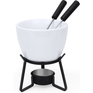 A white fondue pot with a black metal stand and two long forks. Ideal for serving melted cheese or chocolate.