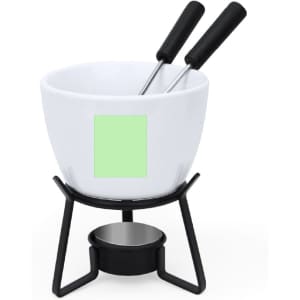 A white fondue pot with two black handles, resting on a black metal stand with a candle underneath.
