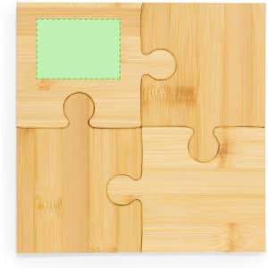 A bamboo coaster set featuring puzzle piece designs with a light green square insert and natural wood finish.
