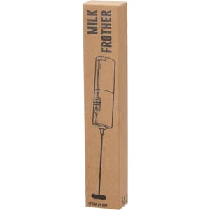A cardboard box containing a black milk frother with a thin whisk attachment. The box features a logo.
