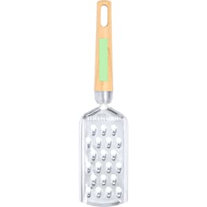 A stainless steel grater with a light green handle and wooden accents, designed for home use.