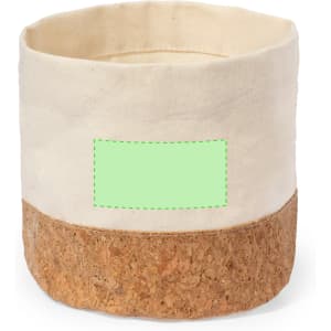 A round storage basket with a cream fabric upper section and a cork base, featuring a logo on the side.