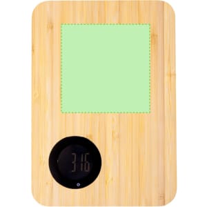 A bamboo chopping board with a digital weighing scale and a green measuring area.