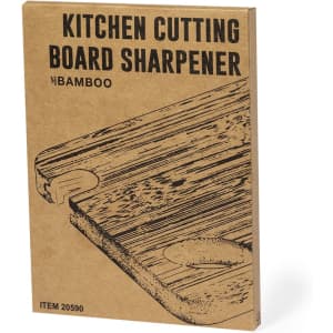 A bamboo kitchen cutting board sharpener in a brown cardboard packaging with a simple illustration.