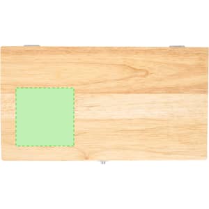 A wooden cheese board with a smooth surface and a small green square. The board features metal hinges.