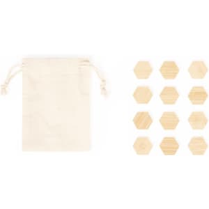 A beige drawstring pouch beside twelve wooden hexagonal pieces, showcasing natural wood texture.