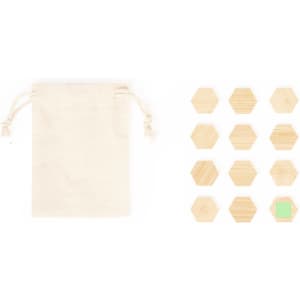 A canvas pouch alongside a set of twelve wooden hexagonal magnets, including one green magnet.