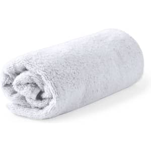 A rolled light grey towel with a soft texture, designed for health and personal use. It features a logo.